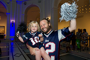 steven and ivy smiling with pom poms